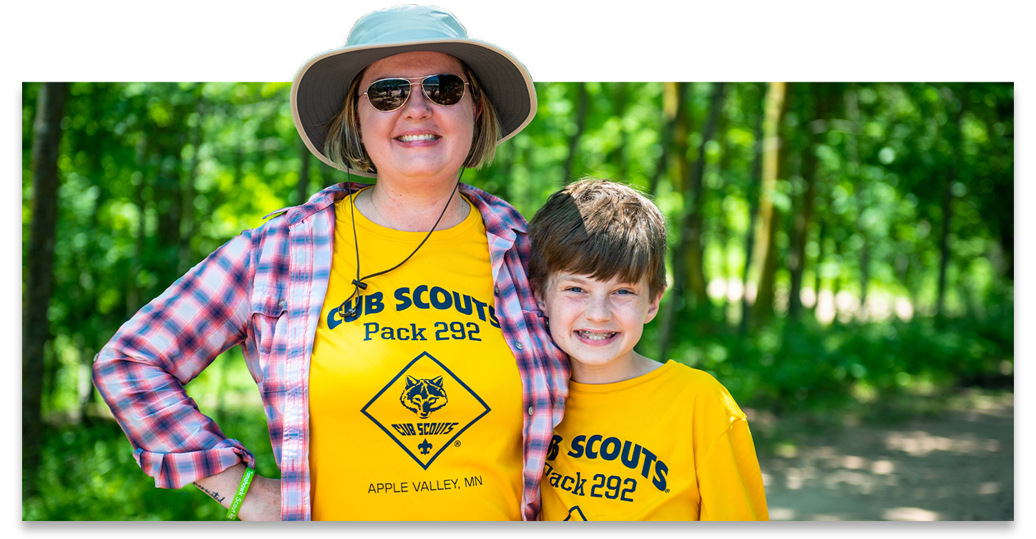 A mom and son are both wearing a t-shirt that says Cub Scout Pack 292