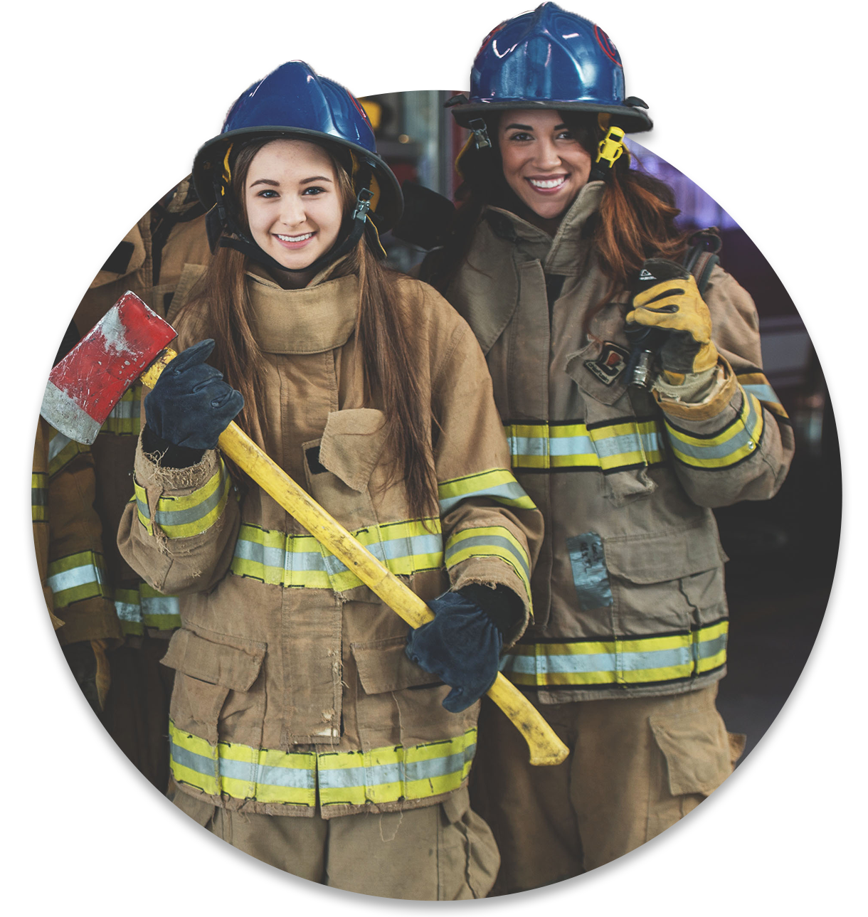 Two older teenagers are smiling while wear firefighting uniforms